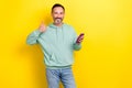 Photo of mature age positive smile businessman wear khaki sweater hold phone rate thumb up like video youtube isolated Royalty Free Stock Photo