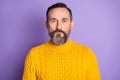 Photo of mature handsome man beard serious confident wear casual sweater isolated over violet color background