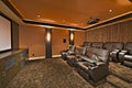 Media room with leather furniture in luxury mansion Royalty Free Stock Photo