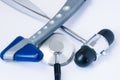Photo of medical diagnostic instruments or equipments, including two neurological rubber hammer and a stethoscope, which are on a