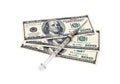 Photo of a medical syringe and paper money