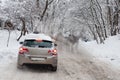 A photo of men push a car that got stuck in a snow at Holosiivskyi National Nature Park, Kyiv, Ukraine Royalty Free Stock Photo