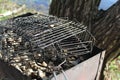 Barbecue grates and a grill with coals