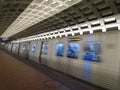 Photo of a metro train in Washington DC accelerating away from the train station