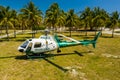 Photo of a Miami Dade police Helicopter in a field of grass