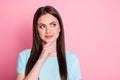 Photo of minded girl touch hand chin look copyspace think isolated over pink color background