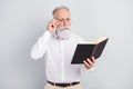 Photo of minded smart old man wear glasses red book novel wear white shirt isolated on grey color background