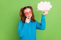 Photo of minded young thoughtful girl look hold hand cloud bubble minded isolated on green color background