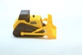 Photo of a miniature bulldozer as a tool to introduce development equipment to children in school Royalty Free Stock Photo
