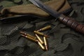 Photo of 5.56mm ammunition, and combat tactical knife