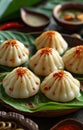 A photo of modak placed on a leaf, gudi padwa sweets and cuisine image