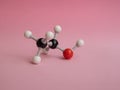 Photo of a molecular atom model on a pink background