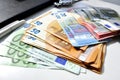 Photo of money, paper bills lying on the table. Bright image of money, euros in sunlight.