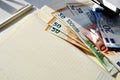 Photo of money, paper bills lying on the table. Bright image of money, euros in sunlight.