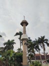 photo of a mosque minaret in the city of Malang, Indonesia with a beautiful view of the evening sky in the background
