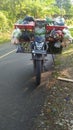 Photo of a motorbike carrying a vegetable cart