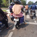 motorbike riders are waiting for traffic lights around Jakarta