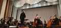 Photo musicians. Musical concert in the Philharmonic. Violin player. Music concert background