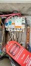 A photo of a name tag with information electrical about the dangers of using it, 26 December 2023, Karawang Indonesia