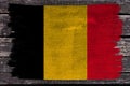 Photo of the national flag of Belgium on a luxurious texture of satin, silk with waves, folds and highlights, close-up, copy space Royalty Free Stock Photo