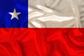 Photo of the national flag of Chile on a luxurious texture of satin, silk with waves, folds and highlights, close-up, copy space,