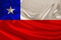 Photo of the national flag of Chile on a luxurious texture of satin, silk with waves, folds and highlights, close-up, copy space, Royalty Free Stock Photo