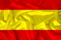 Photo of the national flag of the state of Spain on a luxurious texture of satin, silk with waves, folds and highlights, closeup,