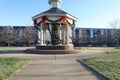 photo of a neighborhood gazebo with decorated Christmas tree down a paved path Royalty Free Stock Photo