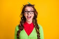 Photo of nerd teenager girl with pencil messy hairdo excited wear green clothes isolated shine color background