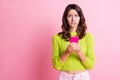 Photo of nervous frightened girl hold cellphone bite lip look empty space wear green pullover isolated pink color