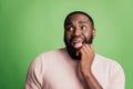 Photo of nervous man look empty space wear white shirt over green background