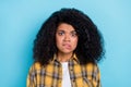 Photo of nervous scared lady bite lip watch horror movie moment wear plaid shirt isolated blue color background