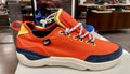 Photo of the New Lacoste Subra Impact 220 orange and yellow trim athletic mens shoes in store