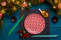 Photo of New Year branches of fir, black board, sushi sticks, prediction cookies, Royalty Free Stock Photo