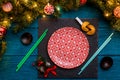 Photo of New Year branches of fir, black board, sushi sticks, prediction cookies, Royalty Free Stock Photo