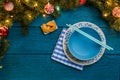 Photo of New Year branches of fir, cookies with prediction, plates, sticks for sushi Royalty Free Stock Photo