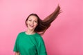 Photo of nice adorable pretty good mood girl with long hairstyle dressed green t-shirt beauty salon ad isolated on pink Royalty Free Stock Photo