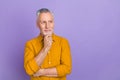 Photo of nice aged grey hairdo man hands face look promo wear yellow shirt isolated on purple color background Royalty Free Stock Photo