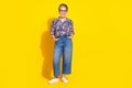 Photo of nice aged lady posing empty space wear shirt isolated on yellow color background Royalty Free Stock Photo