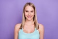 Photo of nice blond young lady wear teal top isolated on violet color background