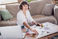 Photo of nice brunette young lady do art wear white shirt sit at home alone Royalty Free Stock Photo