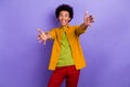 Photo of nice cheerful optimistic candid man wear stylish yellow clothes open hadns hug you isolated on violet color Royalty Free Stock Photo