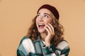 Photo of nice cheerful woman smiling and talking on cellphone