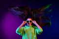 Photo of nice cool young nice woman long hair blow wind clubber good mood isolated on neon background