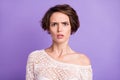 Photo of nice hairdo unsatisfied young girl sullen face look curious camera on violet color background