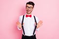 Photo of nice impressed brown hair guy wear spectacles white shirt isolated on pastel pink color background Royalty Free Stock Photo