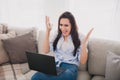 Photo of nice lady yell raise hands use laptop wear blue shirt bright interior flat indoors