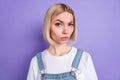 Photo of nice unsure short hairdo blond lady wear white t-shirt isolated on violet color background