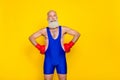 Photo of old age pensioner professional boxer training coach excited positive good mood wear red gloves isolated on Royalty Free Stock Photo