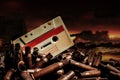 Photo of an old audio tape cassette on pile of bullets Royalty Free Stock Photo